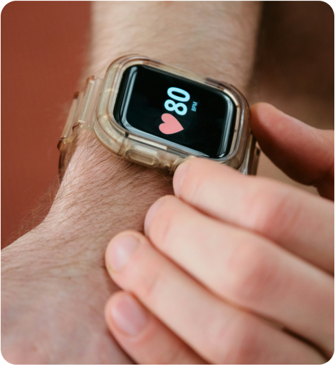 Wristwatch displaying heart rate of 80 BPM on a person's wrist.