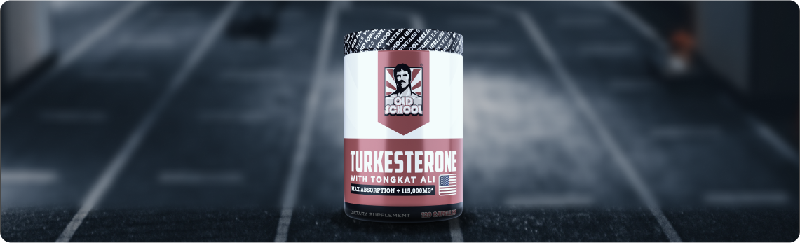 Bottle of Old School Labs Turkesterone dietary supplement with Tongkat Ali on a blurred background.