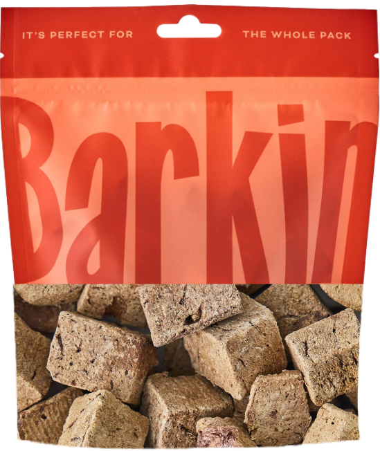 Red bag of dog treats labeled 'Barkin' with visible treats inside.