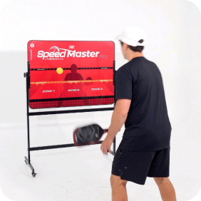 Person playing paddle ball with a red Speed Master training board.