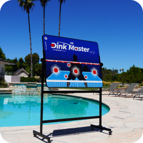 Pickleball practice target near a pool under a clear blue sky.