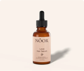 Brown bottle labeled 'NOOR Love Hair Serum' with dropper lid.