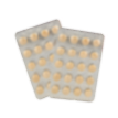 Two blister packs of beige pills.