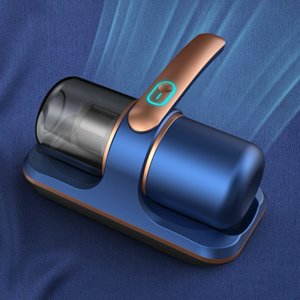 Compact blue and bronze handheld vacuum cleaner on a fabric surface.
