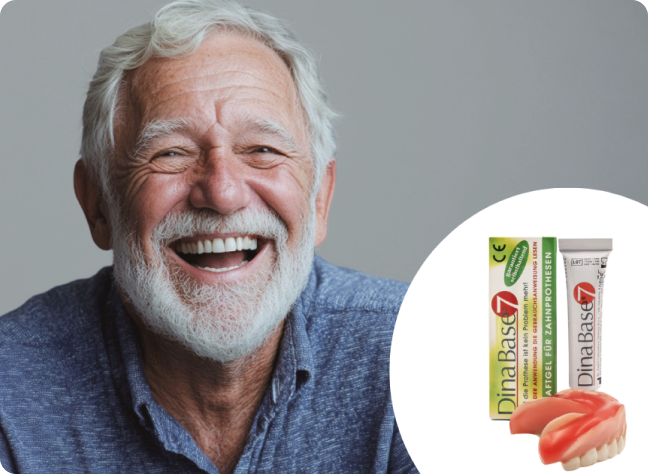 Smiling man beside dental care product and dentures.