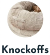 A cozy, round, beige pet bed with the word 'Knockoffs' below.