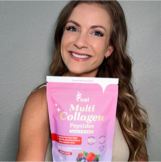 A person smiling while holding a bag of multi collagen peptides.