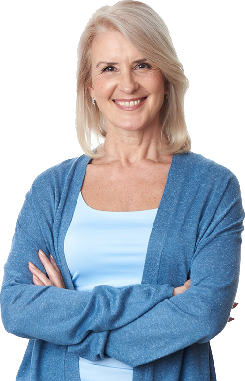 Smiling woman in a blue cardigan with arms crossed.