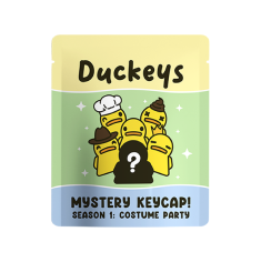 Duck-themed mystery keycap packaging featuring costumed duck characters.