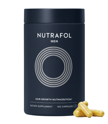 Dark blue container of Nutrafol men's hair growth supplement with capsules placed beside it.