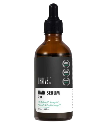 A bottle of Thrive hair serum 2.0 with a dropper cap.