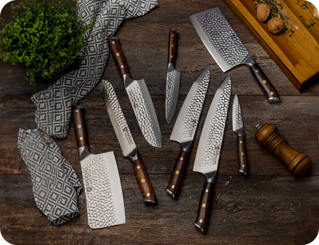 A set of elegant knives with wooden handles displayed on a wooden surface with a patterned cloth.