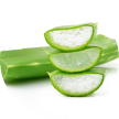 Sliced aloe vera leaves stacked on a whole aloe vera leaf.