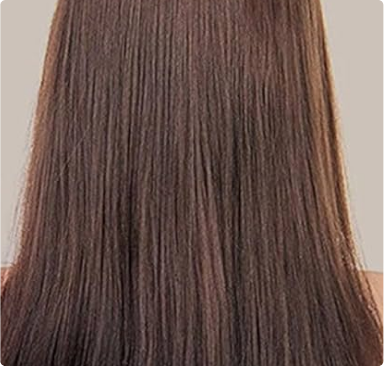 Brown, straight hair viewed from the back against a neutral background.