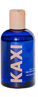 Blue Kaxi hair oil bottle with a peach cap.