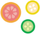 Three colorful citrus slices: grapefruit, lemon, and lime, arranged together.