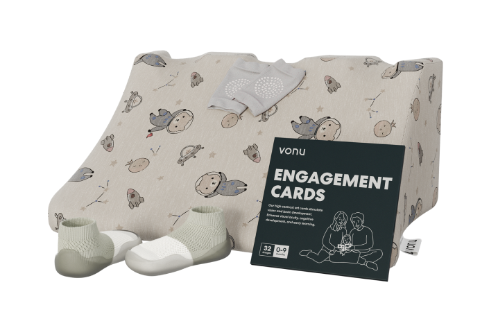 Baby shoes, socks, themed cushion, and engagement cards for children aged 0-9 months.