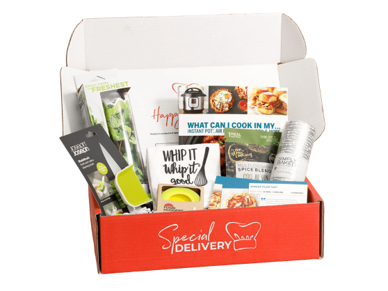 Red Special Delivery box with cooking-related items and recipe cards.