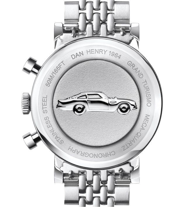 The back of a stainless steel watch featuring an engraved car illustration.