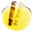 A pipette dropping yellow liquid into a petri dish.