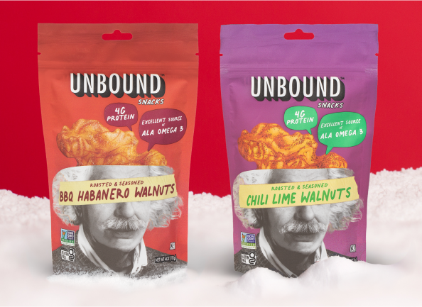 Two Unbound snack bags: BBQ Habanero and Chili Lime Walnuts on a snowy surface.