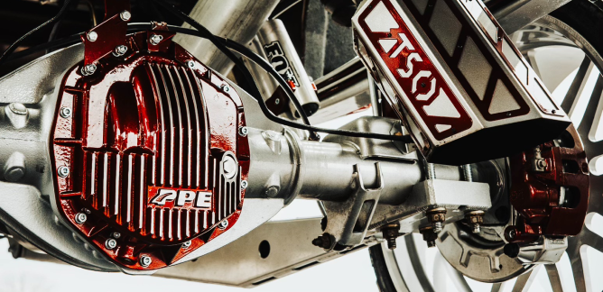 Chrome vehicle suspension system with red PPE differential cover.