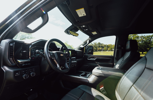 Interior view of a modern truck with black seats and dashboard.