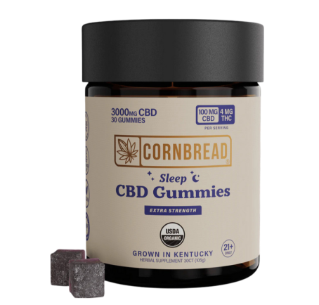 Bottle of Cornbread Extra Strength Sleep CBD Gummies with two gummies beside it.